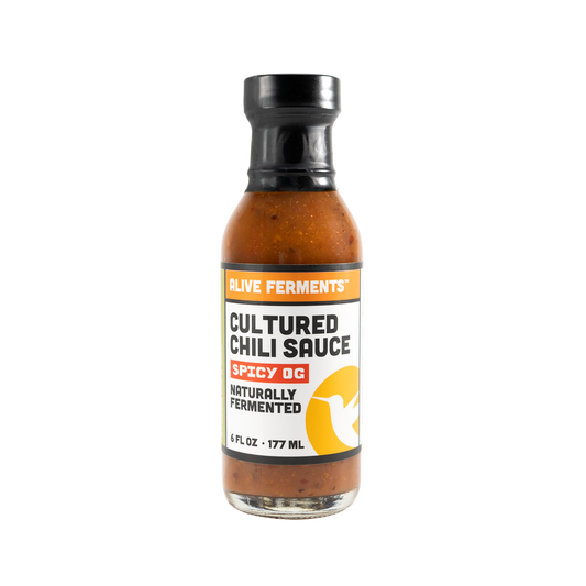 Bottle of Cultured Chili Sauce on a white background