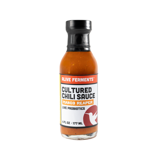 Bottle of Cultured Chili Sauce on a white background